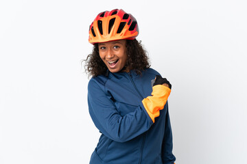Teenager cyclist woman isolated on white background celebrating a victory