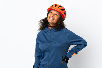 Teenager cyclist woman isolated on white background thinking an idea while looking up