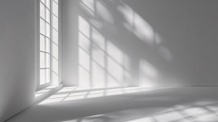 Obraz premium Gray Background to Present the Product with Shadows and Light from the Window: A gray background used to present products, capturing shadows and light from a window.