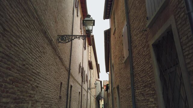 Narrow street of the historic center in Forl&igrave;, Italy