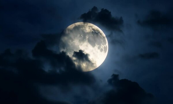 Shining echo in the night sky in flying clouds.