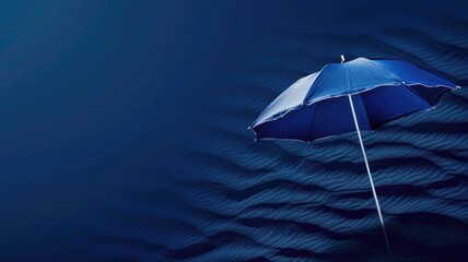 Blue umbrella on wavy sand, minimalist artistic scenery