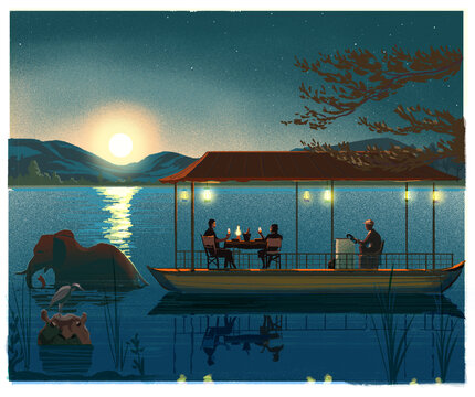 People dining on a riverboat on the Zambezi River, Zimbabwe 