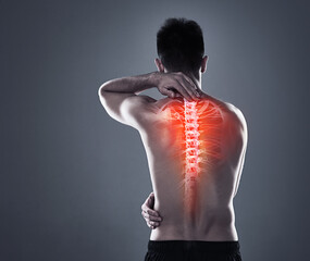 Man, injury and back pain of fitness in studio, anatomy of spine and xray for diagnosis. Red glow,...