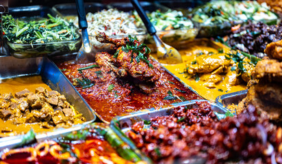 Traditional Asian dishes sold in a food court in Singapore