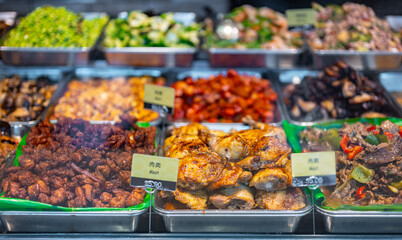 Traditional Asian dishes sold in a food court in Singapore