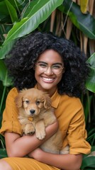 Obraz premium A Black woman with curly hair smiling while holding a puppy
