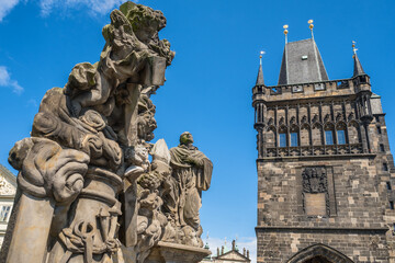 Fototapeta premium Charles Bridge with historic statues and Old Town Bridge Tower in Prague