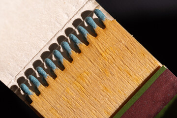 Set of wooden matches with the head or blue flammable material.