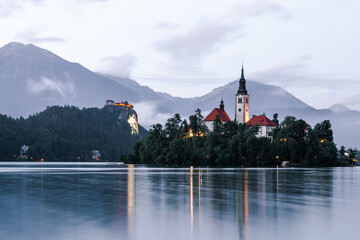 Bled, Slovenia (Slovenija), A chatolic church on the island in the lake by the mountainside with...