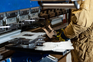 Bending and processing of metal at a factory on a machine
