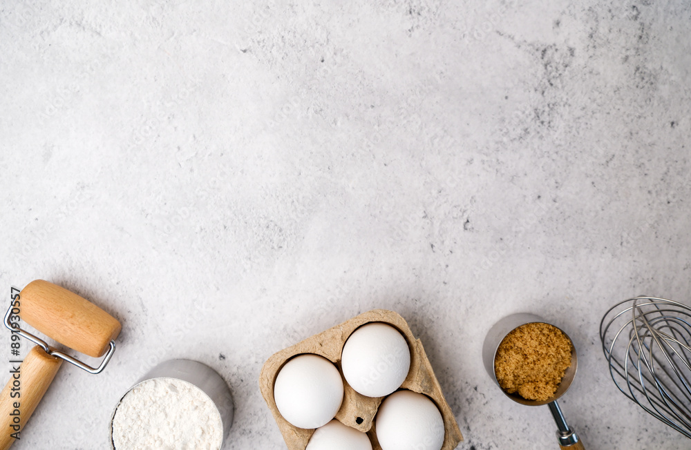 Wall mural baking background with cooking ingredients includes flour, sugar, eggs, and a wooden rolling pin on 