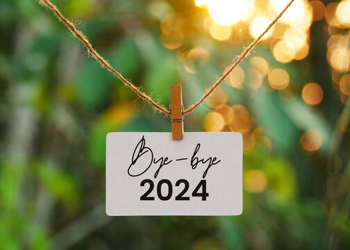 Note paper with text Bye-bye 2024 hanging on a rope, concept of saying goodbye to 2024 and welcoming new year 2025.
