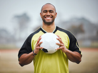 Sport portrait, soccer player and man with ball on field for game training, practice or smile for workout. Football, athlete and happy person for match fitness, exercise or confidence for competition