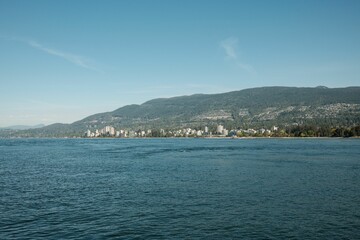 Fototapeta premium Scenic view of North Vancouver mountains over the water
