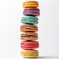 macarons arranged in a vertical tower. Each macaron is a different color, creating a visually appealing rainbow effect. The macarons have a delicate, smooth texture with a creamy filling visible