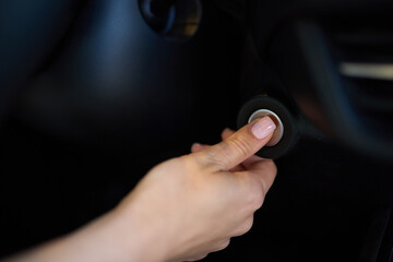 To start a car, the engine is initiated by turning a key in the ignition switch with the hand