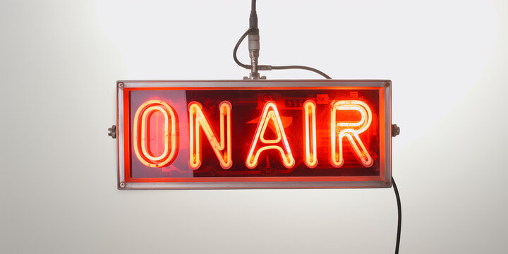 Red neon on air sign is hanging and glowing