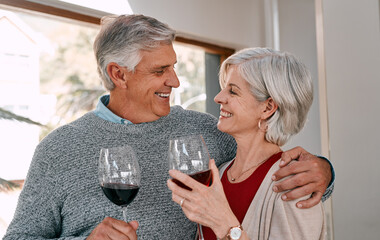 Mature couple, wine glasses and hug in home, romance and drinks for love in relationship. Happy people, embrace and alcohol for bonding on weekend, commitment and affection for marriage to relax