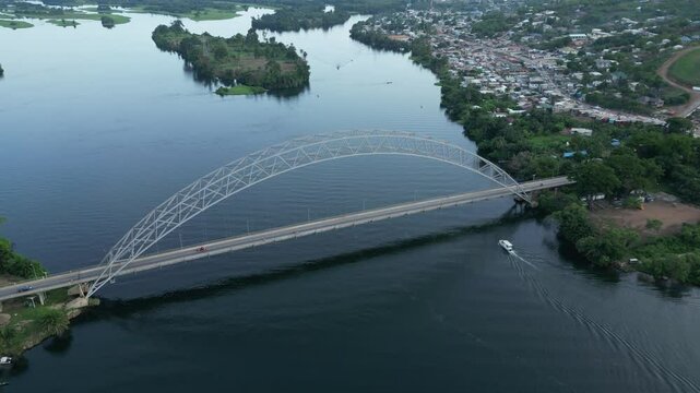 Drone shot of Boat cruise under the Adomi Bridge in Akosombo, Ghana