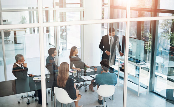 Presentation, technology and business people in meeting at office for corporate revenue, profit and finance data. Statistics, discussion and financial advisors with company stock investment strategy.