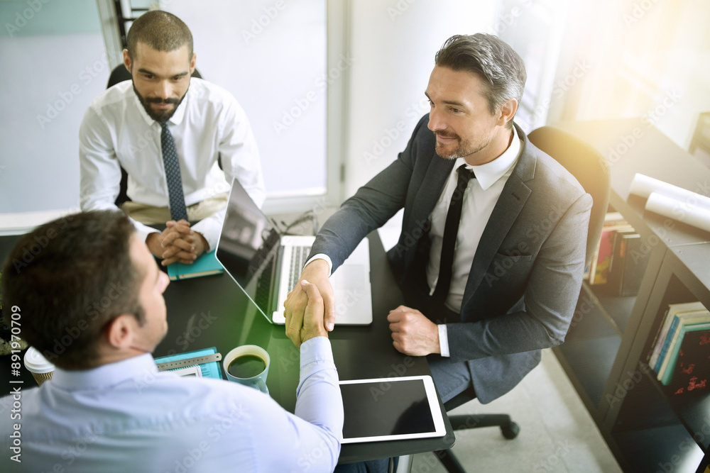 Aufkleber the beginning of a profitable partnership. shot of colleagues shaking hands during a formal meeting 