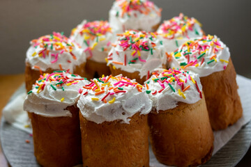 homemade easter cakes with icing and sprinkles on a plate 