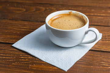 Hand written note on a coffee stained napkin with an empowe