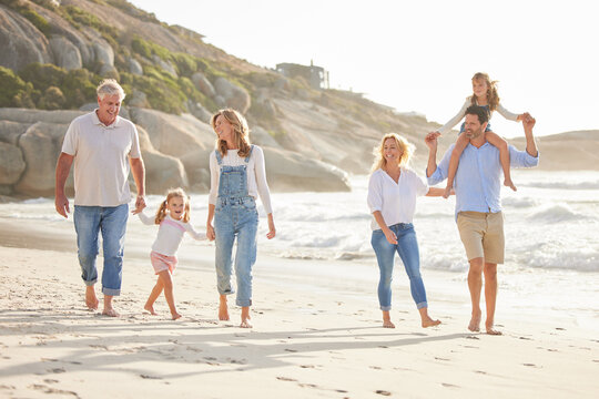 Beach, walking and kids with parents and grandparents on summer vacation, adventure or holiday. Holding hands, love and family with generations by ocean for tropical weekend trip in Australia.