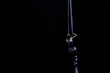 Female gymnast on cloth acrobatic circus performer