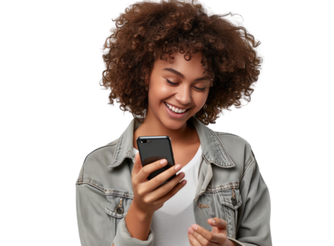 A portrait of a young African American black woman with curly hair looking at her mobile phone and smiling, isolated in a transparent background. Cut out or PNG.