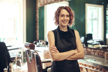 Hair care, confidence and portrait of woman in barbershop with stylist, hairdresser or small...