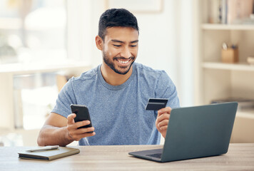 Desk, smile and man with card, cellphone and ecommerce to watch film, digital and online in home office. House, shopping and purchase of subscription, table and laptop for streaming of movies