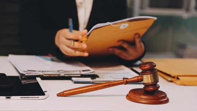 Lawyer office. Statue of Justice with scales and lawyer working on a laptop. Legal law, advice and justice concept.