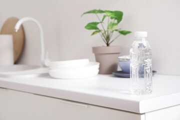Bottle of water on counter in kitchen, closeup