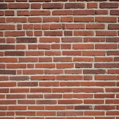 Fototapeta premium Orange brown red brick wall. Texture of old dark brown and red brick wall.