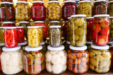 Canned fruits and vegetables in glass jars