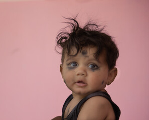 Curious Baby with Messy Hair and Smudged Face