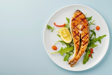 A plate of food with a fish fillet and a lemon wedge