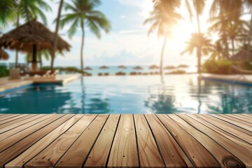 Fototapeta premium Clear wooden tabletop with a softly blurred background of a tropical resort pool, palm trees, and ocean view, perfect for product placement