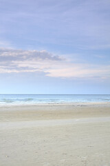 Horizon, sky and sand with landscape of beach for travel location, holiday and vacation in Denmark. Clouds, water or ocean with background of natural environment with sea shore for tropical adventure