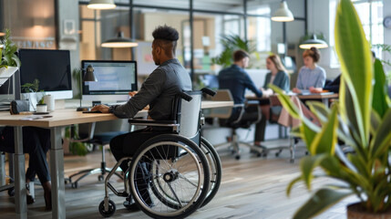 Inclusive Workplace - Wheelchair User Engaged in Office Collaboration with Colleagues