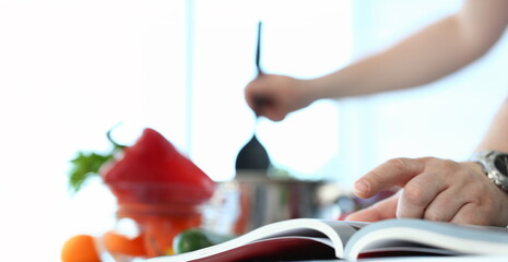 Male Finger Pointing Cookery Book Recipe Photo. CookBook with Healthy Food Ingredients. Hands...