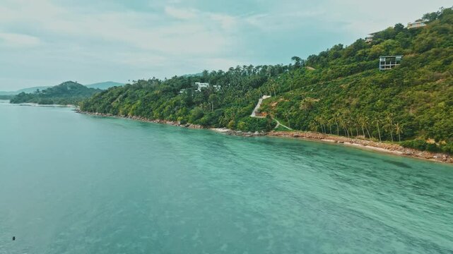 Drone Flying Over Emerald Sea Toward Lush Green Island with Coconut Palms, Summer Vacation, Samui, Thailand