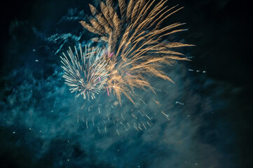 Fototapeta premium Fireworks with blurred light pattern as background.