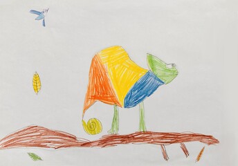 Child's drawing of a colorful chameleon with green, yellow, orange, and blue sections.