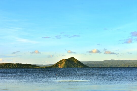 Talisay, Batangas, Philippines - December 18, 2022: Taal Volcano rises from tranquil lake&rsquo;s embrace.