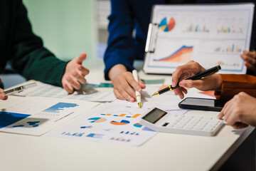 Close-up of hands working on UX/UI design at a desk. Papers with wireframes, prototypes, and mockups detail user flows, personas, and A/B testing, ensuring usability and responsive design.