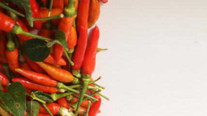 fresh red chilies on a white background