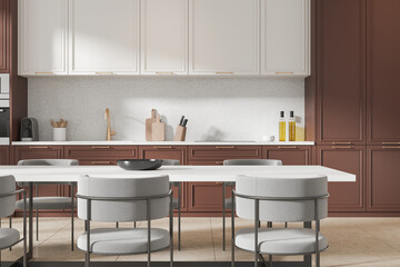 Elegant home kitchen interior with dining table and cooking space, closeup